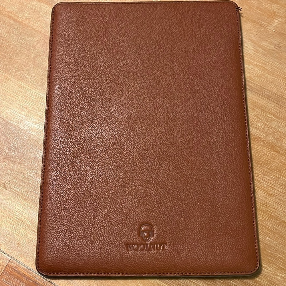 Leather laptop sleeve with wool lining.